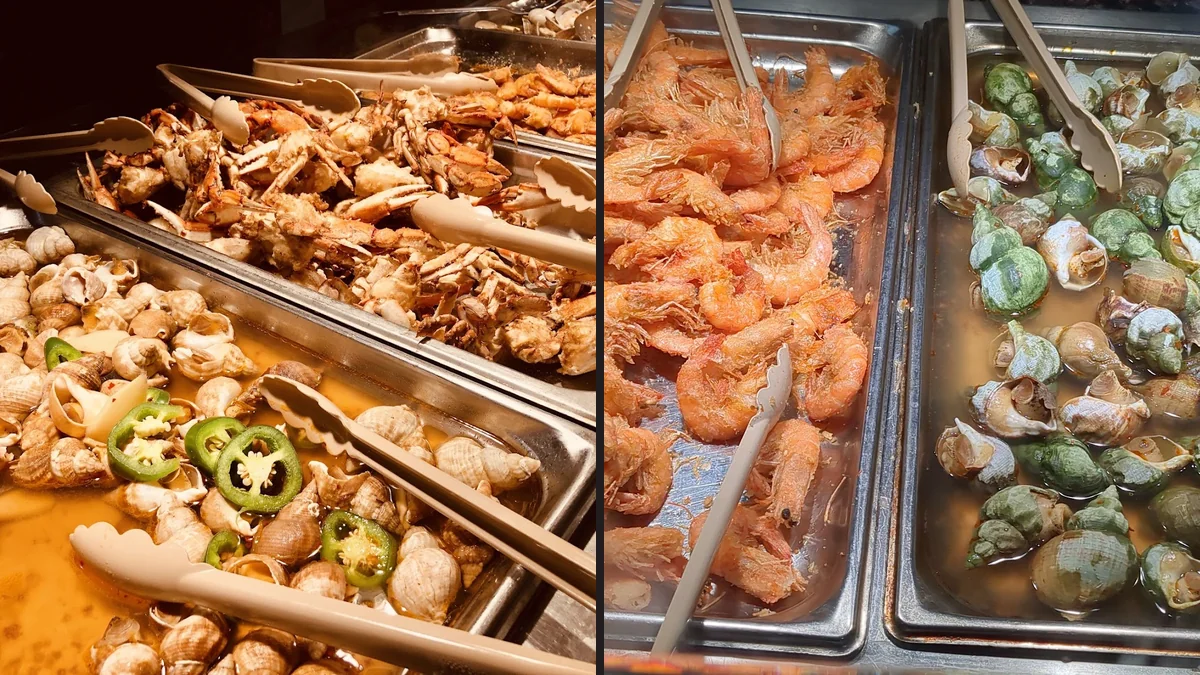 Long serving line inside a casual restaurant.